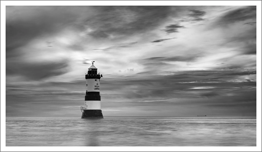 Lighthouse and Distant Ship